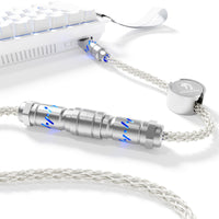MAMBASNAKE C07 Aviator Cable connected to a white keyboard. Featuring metal connector, RGB lighting, and braided cable.