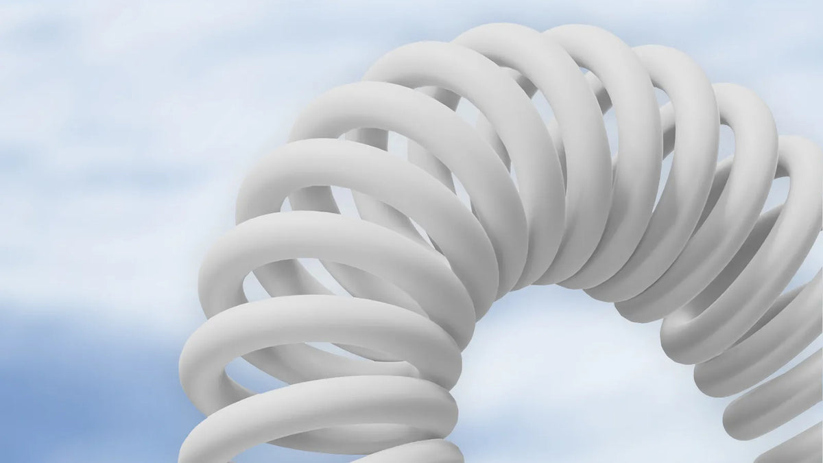 white smooth-jacket coiled keyboard cable with even, tightly spaced coil loops
