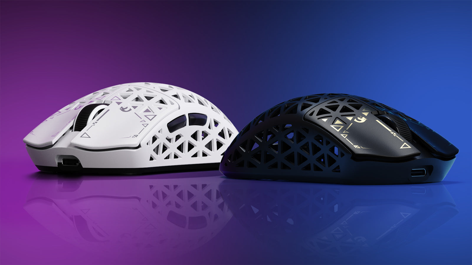 A white and black perforated gaming mouse pair on a reflective surface.