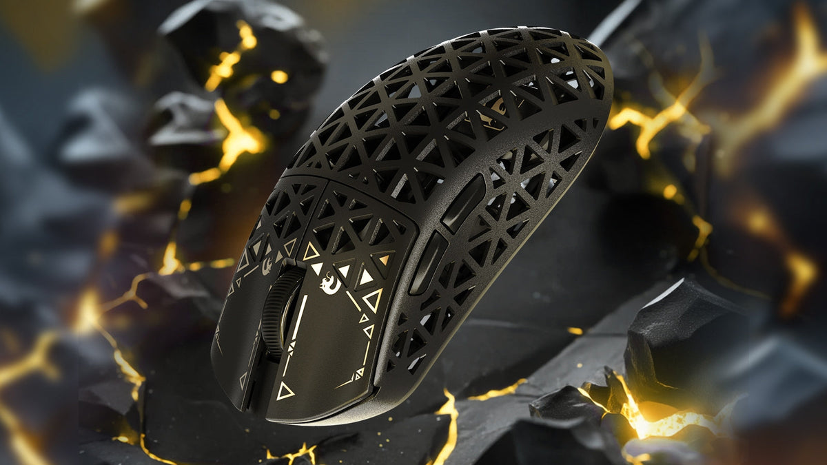 A black  gaming mouse is showcased among  rocks.