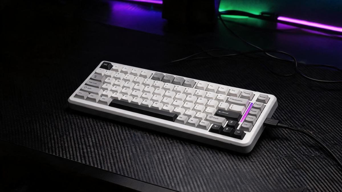 Hall effect gaming keyboard on a carbon-fiber desk in a dark RGB-lit gaming room