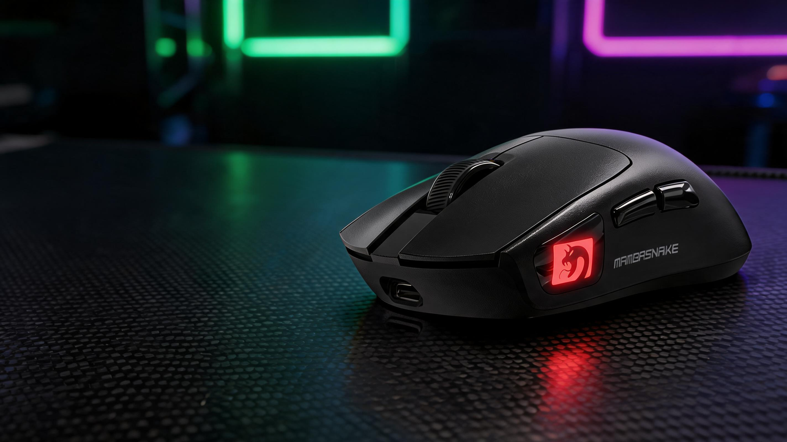 MAMBASNAKE M4 wireless gaming mouse on a carbon-fiber gaming desk with green and purple lighting