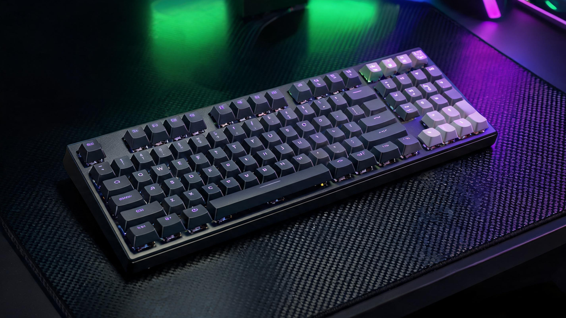 Cherry, OEM, and XDA keycap profiles arranged on a mechanical gaming keyboard in a dark RGB-lit gaming room