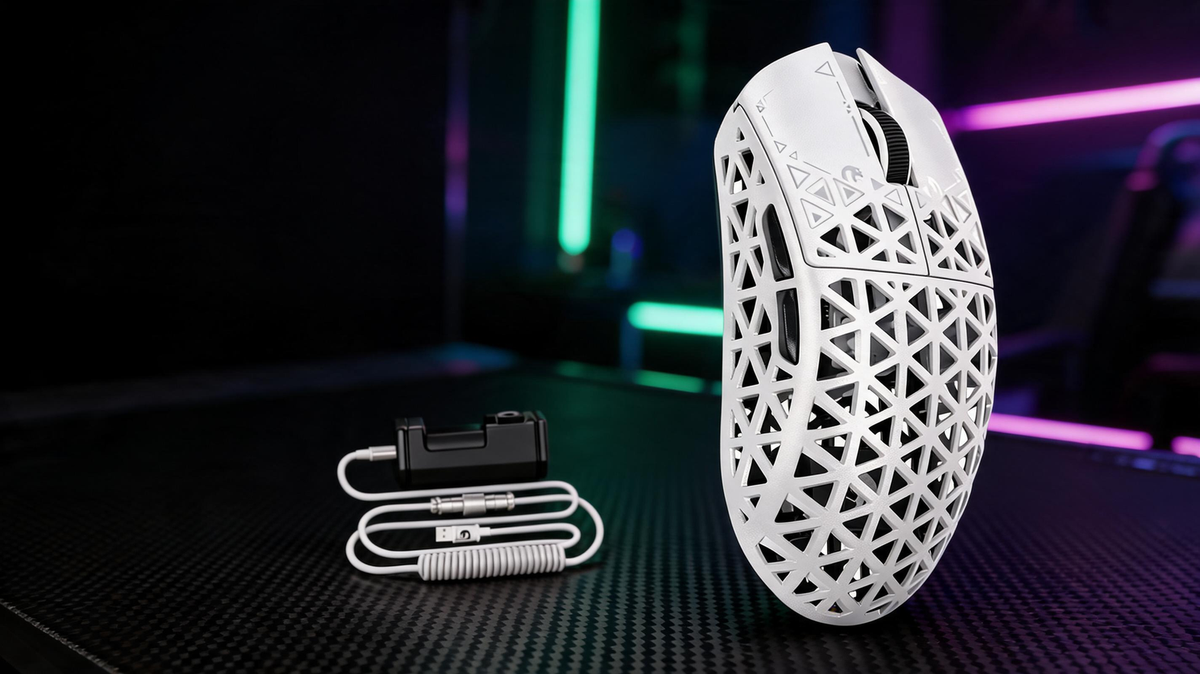 Gaming mouse on a carbon-fiber desk in a dark esports room with saturated green and purple lighting.
