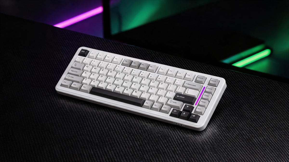 White RGB gaming keyboard on a carbon-fiber desk in a dark esports setup
