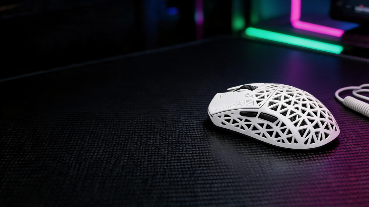 Gaming mouse resting on a carbon-fiber desk in a dark RGB-lit esports workspace, with open space for headline placement