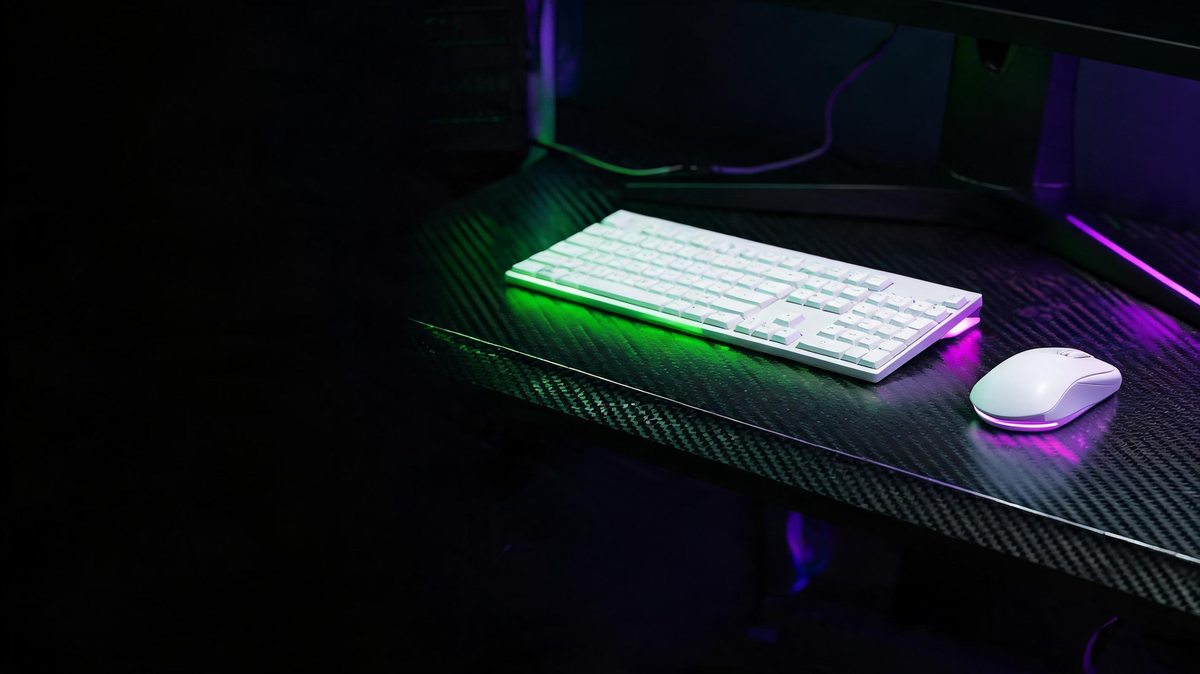 White gaming mouse and keyboard arranged on a carbon-fiber desk in a dark RGB-lit gaming room.
