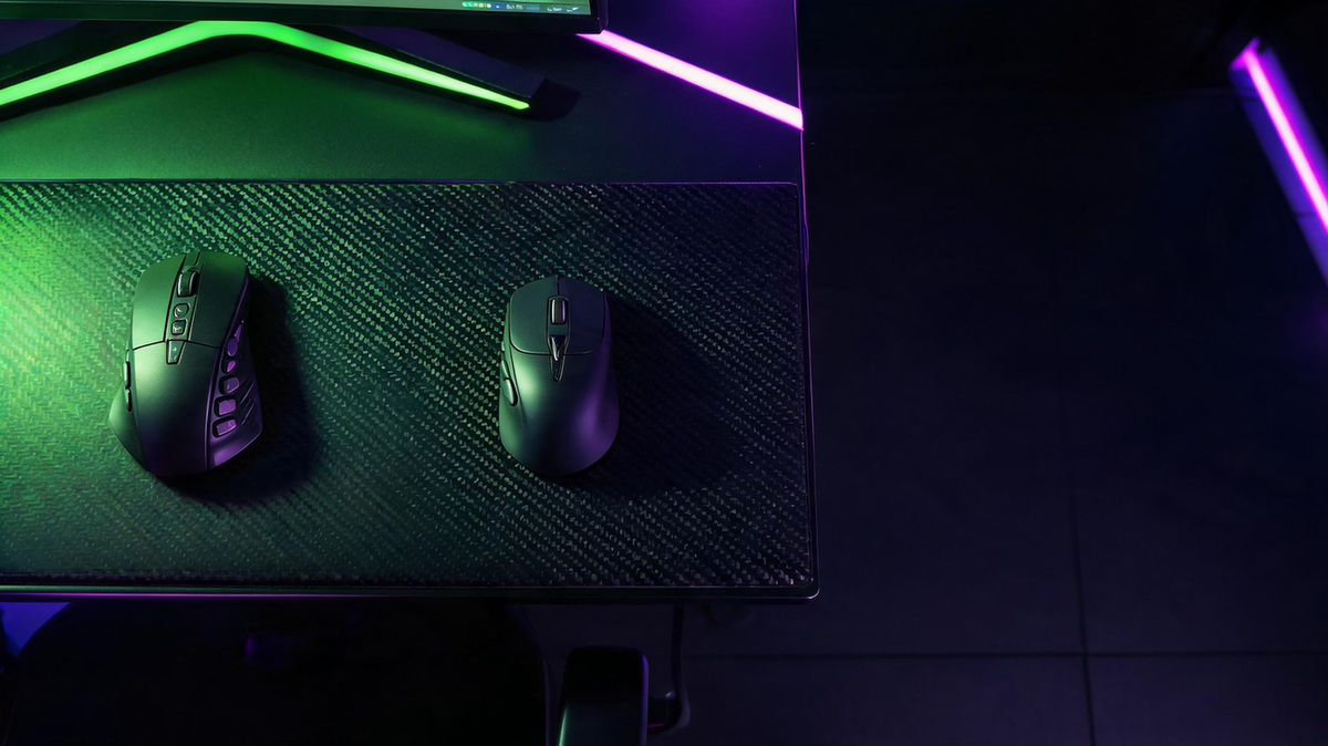 Dark esports gaming desk with a dense side-button MMO mouse concept beside a streamlined lightweight gaming mouse concept, surrounded by saturated neon green and purple RGB lighting