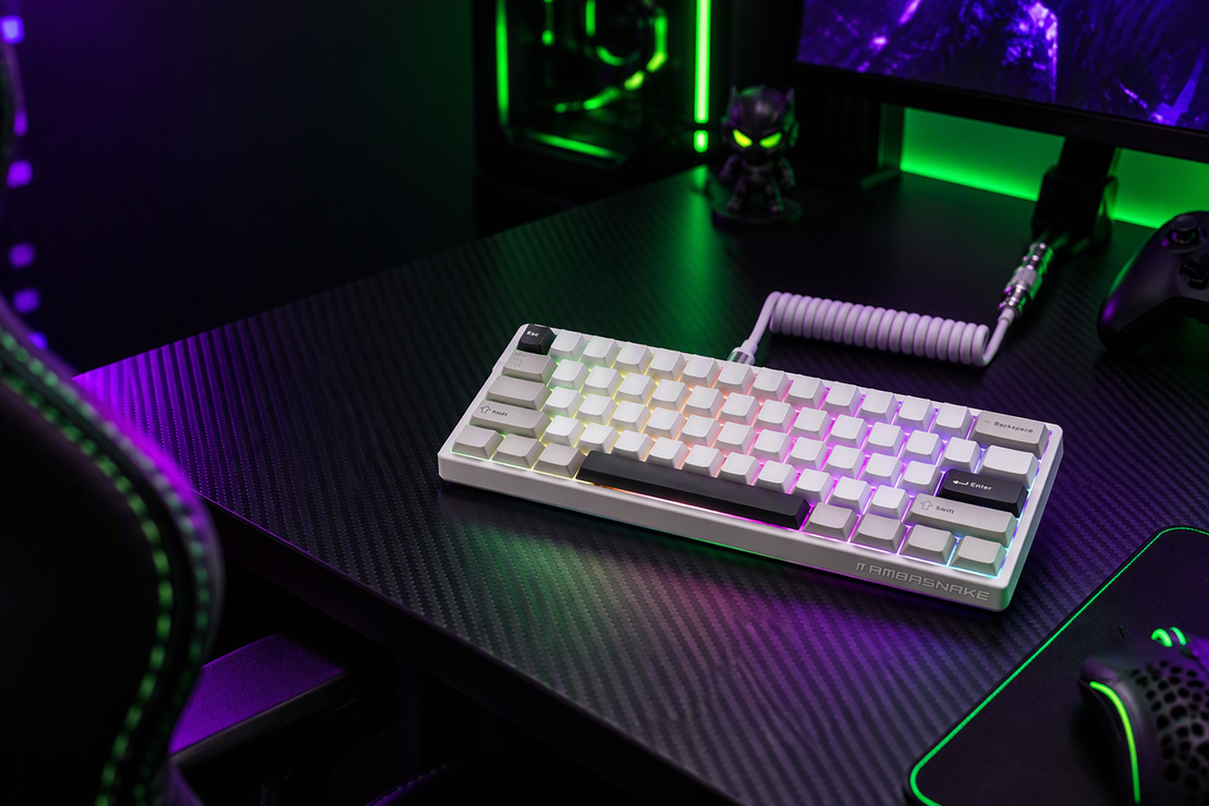White compact magnetic gaming keyboard on a carbon-fiber desk in a dark esports setup, with neon-green and purple RGB lighting and open shadow space for a headline.