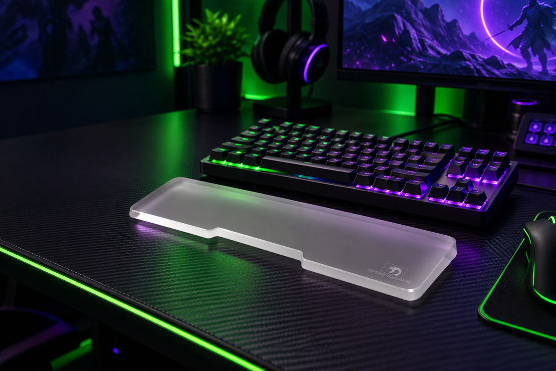 Frosted acrylic wrist rest in front of a keyboard on a neon-lit gaming desk, with dark space to one side.