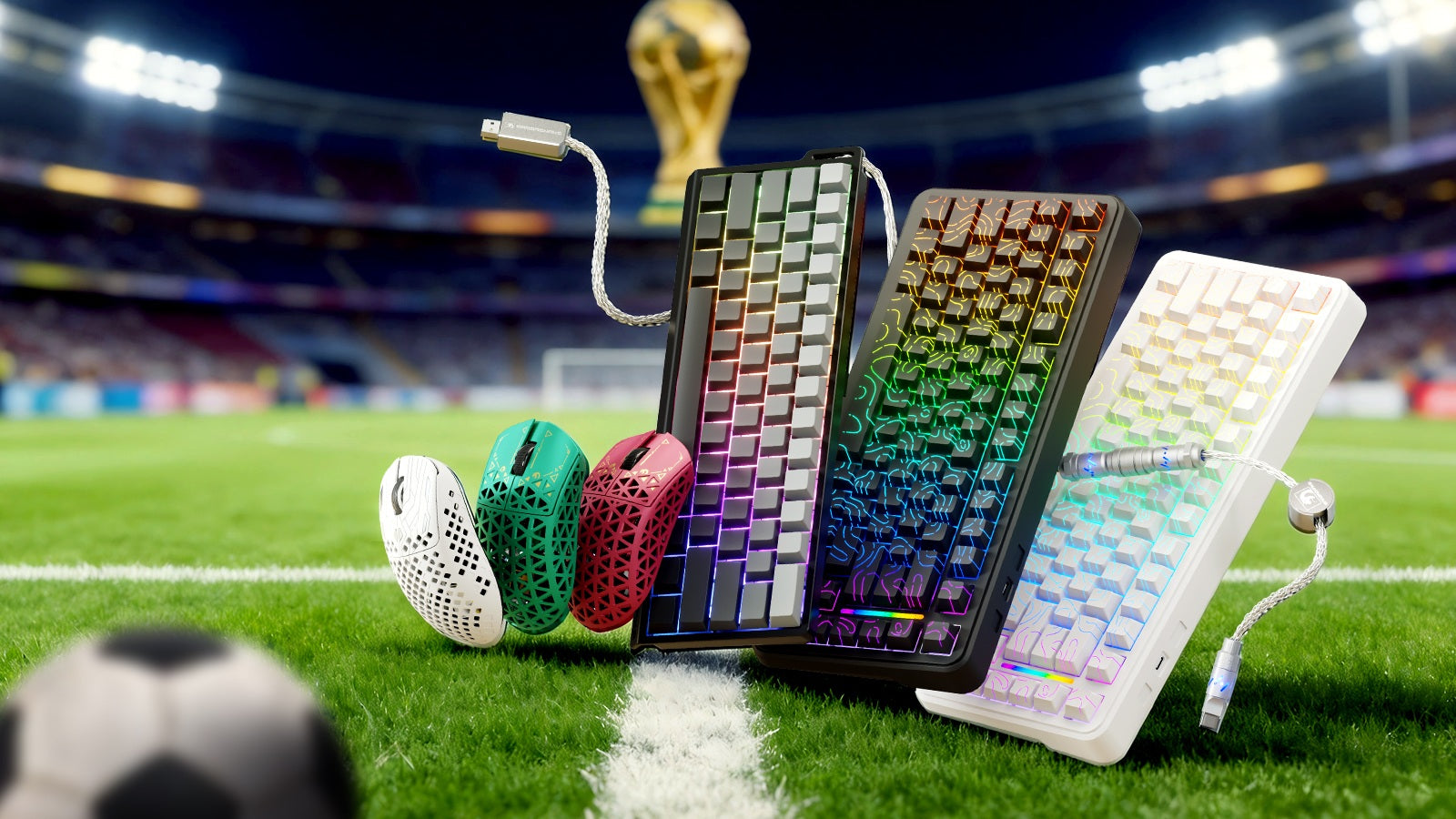 Gaming mice and RGB keyboards displayed on a soccer field with trophy backdrop