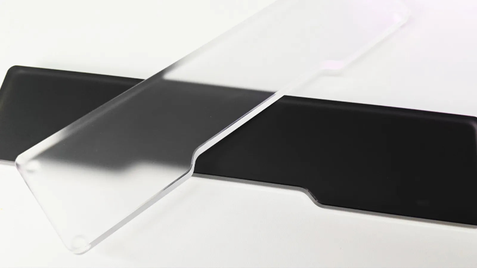 Clear and black acrylic keyboard wrist rest on white background