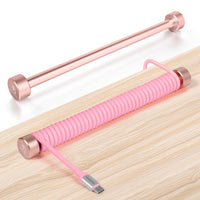 Rose gold aluminum rod and pink coiled USB-C keyboard cable winder